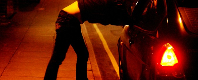 A prostitute talks to a driver in Ipswich's red light area in the early hours of this morning.