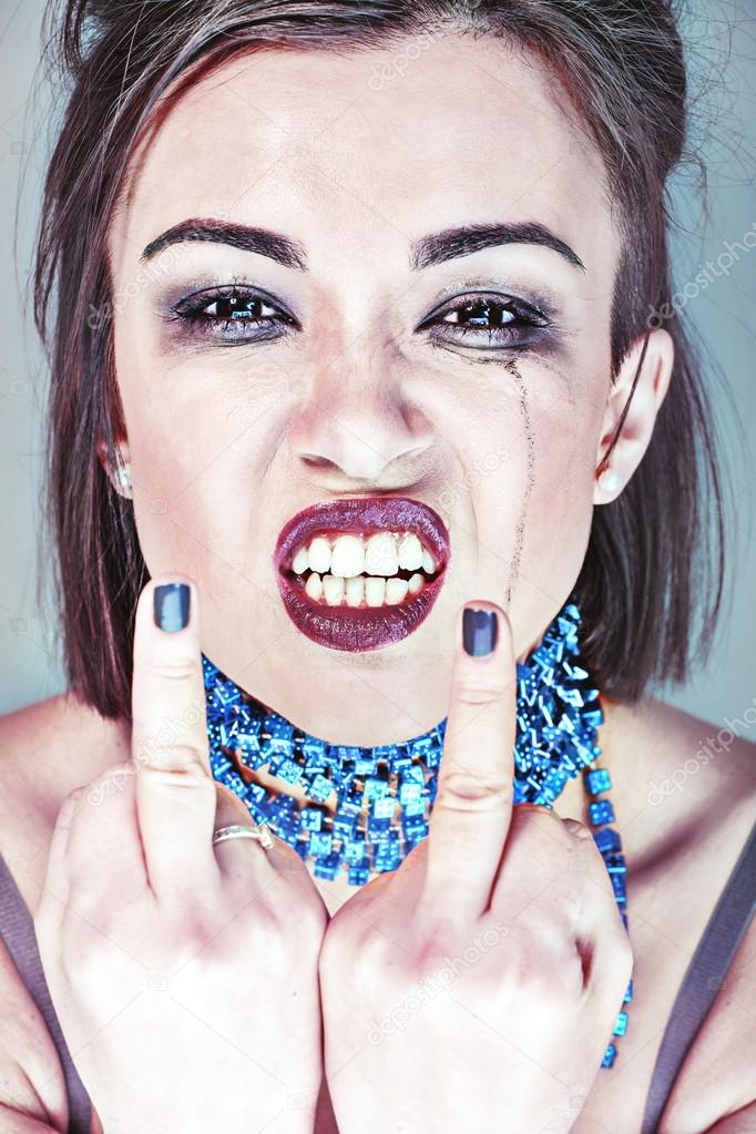 depositphotos_45995497-stock-photo-wicked-girl-showing-middle-finger